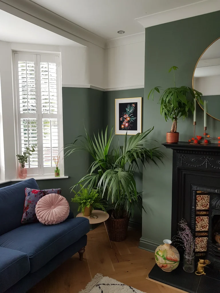 Edwardian interior living room with view of sofa and sage walls